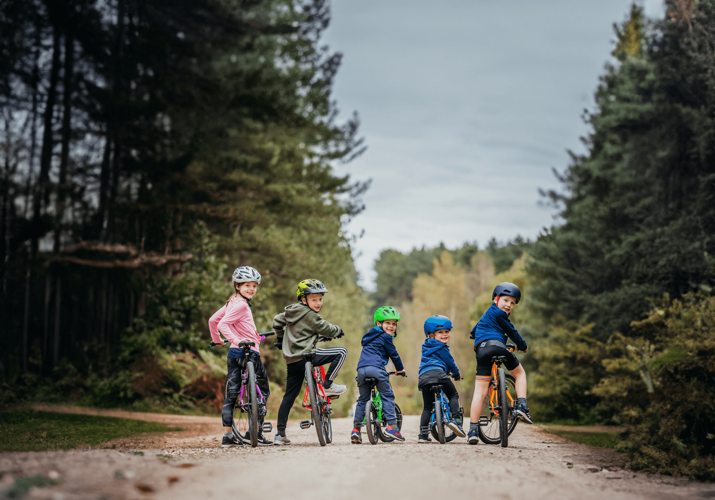 Children on Forme bike on a path in the forest